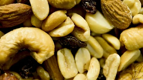 Close up of mixed nuts and dried fruits rotating. Flat plane. Top view Stock Footage 106270789