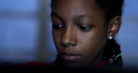 Close-up mixed race child in front of laptop computer at night Stock Footage 143822594