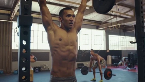 Close up of mixed race man lifting weights Stock Footage 71622492