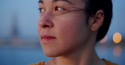 Close up of mixed race young serious woman face thoughtfully looking away at Stock Footage 120943825