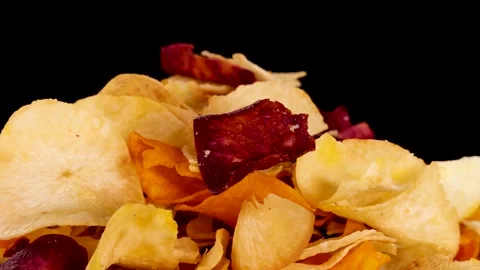 Close-Up of Mixed Root Vegetable Chips Against Black Background Stock Footage 319742632