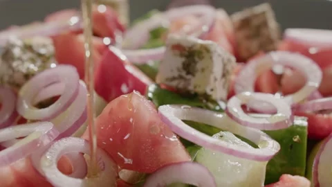 Close up mixed vegetable salad with cucumber, tomato, onion, feta and olive Video stock 151961670