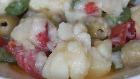 Close up of mixed vegetables and tuna salad in a bowl, spanish recipe, Campera Stock Footage 341556966
