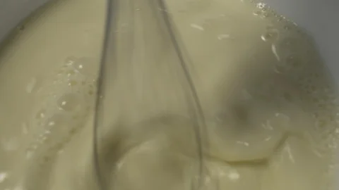 Close-Up Mixer Beats Ingredients for Baking in Bowl Stock Footage 106593410