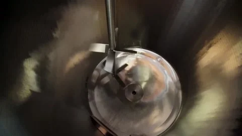 A Close up of mixer blade spinning in container Stock Footage 155533656