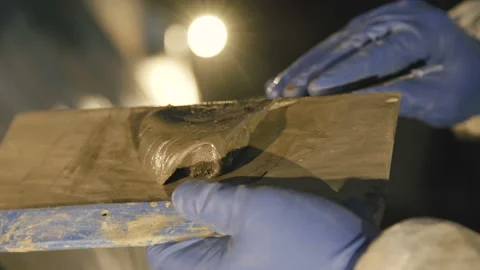 Close up of mixing of auto primer on the spatula. 4K Stock Footage 86829930