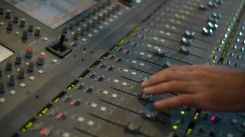 Close-up of a mixing console, the hand adjusts the faders. Sound director works 스톡 동영상 116040239