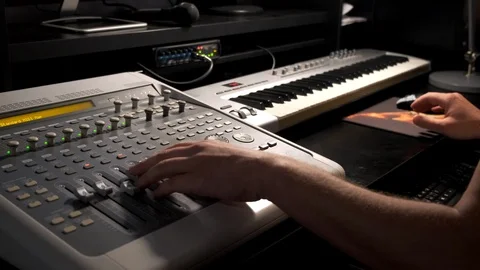 Close-up of a mixing console, the hand adjusts the faders. Sound director works Stock Footage 125634359