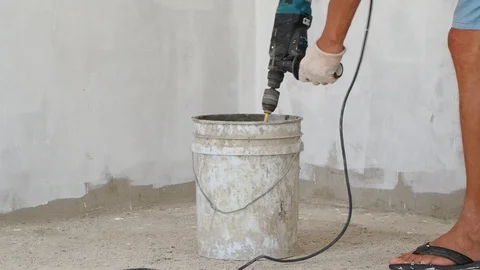 Close-up of mixing mortar for ceramic tiles in a plastic bucket. Stock Footage 112625436