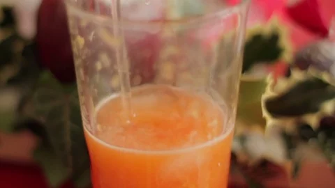 Close Up Mixing Orange Juice Stockbeeldmateriaal 84204355