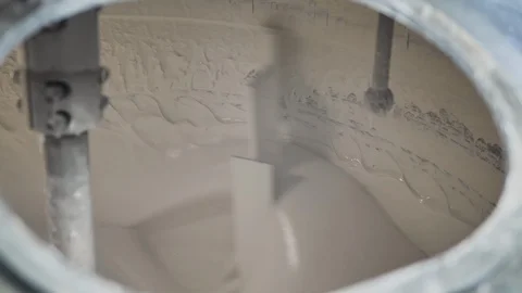 Close up of mixing toothpaste in a large  steel production container. Stock Footage 128455417