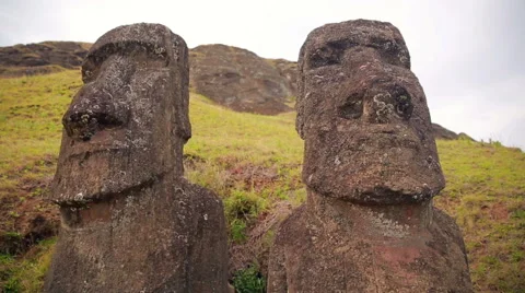 Close-up on the Moai statues down the hill on Easter Island 스톡 동영상 64258812