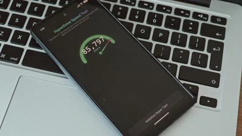 Close up of mobile application benchmarking ultra high speed connection Stock Footage 337998688