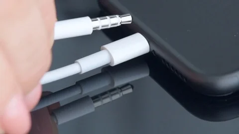 Close up of a mobile phone connected to a charger. Stock Footage