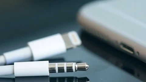 Close up of a mobile phone connected to a charger. Stock Footage 80593560