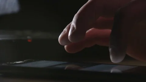 Close Up of mobile phone lying on the table and man hands nervously surfing the Stock Footage 85517218