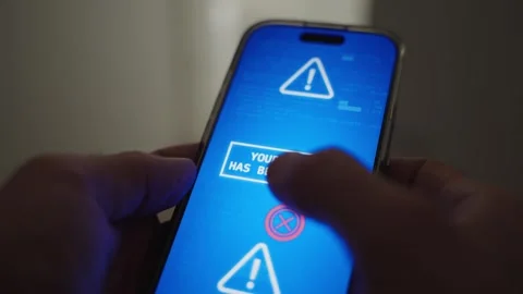 Close up on mobile phone message appearing on screen as device is hacked Stockbeeldmateriaal 329378732