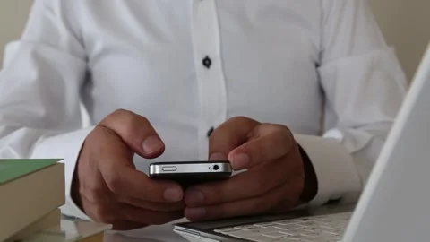 Close Up Mobile Phone Use with Books and Laptop Vidéo 346183826