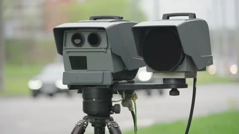 Close-up of a mobile speed trap camera resembling a VITRONIC Poliscan FM1 on a Stock Footage 336587779