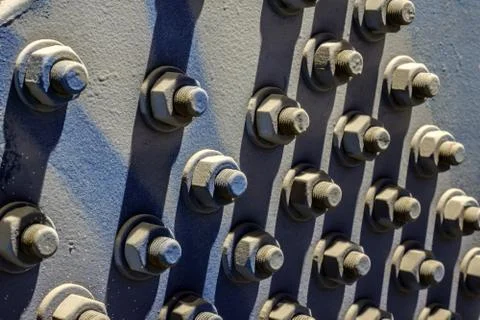A close-up of a mock of large hex nuts with a washer secured by threaded stud Stock Photos