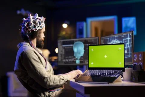 Close up of mockup device next to scientist using tech to gain superintelligence Stock Photos