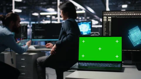 Close up of mockup laptop in server room where worker uses AI Stock Footage 313636727