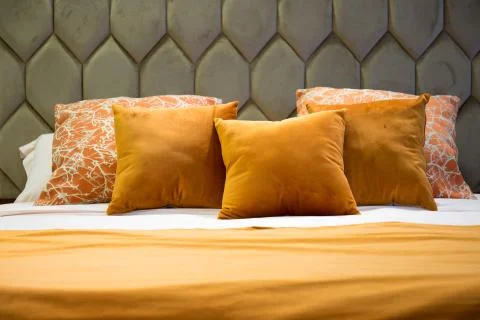 Close-up of a moddern bed with wool bedding and pillows Stock Photos
