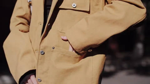 Close Up of Model Putting Hand in Pocket of Stylish Jacket Vídeos de archivo 337504218