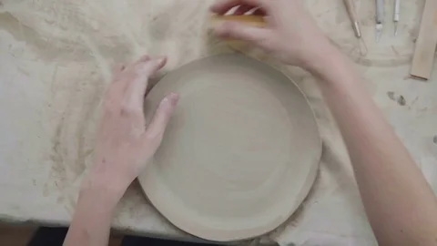 Close-up of modeling clay, the process of creating ceramic plate Video stock 73228908