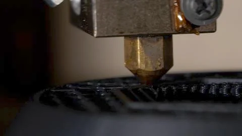 Close up of a modern 3D printer. Head of 3d printer in action. Close Up Of 3D Stock Photos