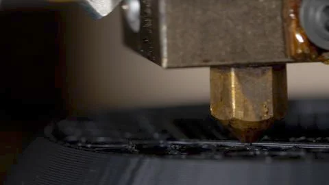 Close up of a modern 3D printer. Head of 3d printer in action. Close Up Of 3D Stock Photos