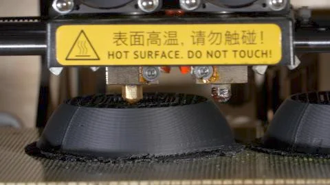 Close up of a modern 3D printer. Head of 3d printer in action. Close Up Of 3D Stock Photos