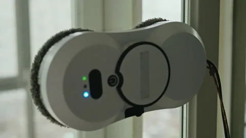 Close-up of modern automatic window cleaning robot efficiently washing large Stock Footage 310796909