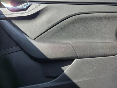 Close-up of a modern car door interior showcasing sleek design, texture, and Stock Photos