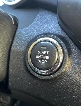 Close-up of Modern Car Engine Start Stop Button on Textured Dashboard – High Det Stock Photos