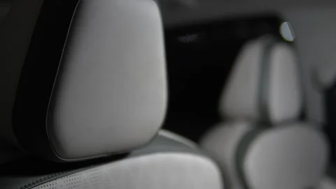 Close-up of modern car interior headrest and upholstered seats with soft li.. Stock Footage 346597484