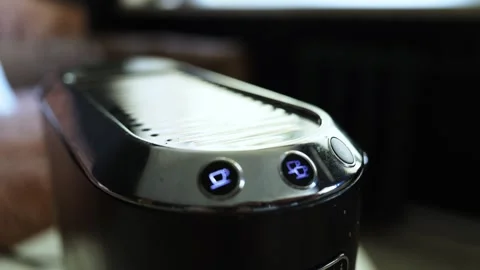 Close-up of a modern coffee machine with illuminated cup icons and buttons Stock Footage 338999778