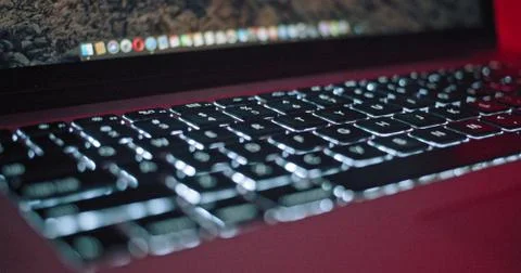 Close-up of modern computer keyboard illumination. Slow motion view laptop Stock Photos