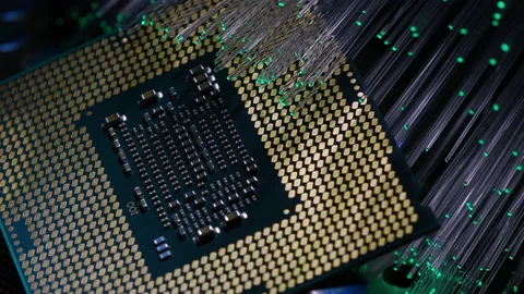 Close up of a modern CPU illuminated by a bunch of colored fiber optics. Stock Footage 219470450