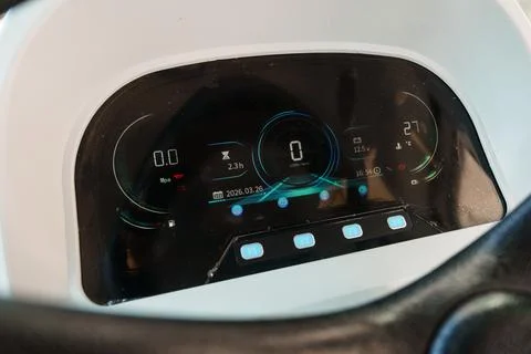 Close up of a modern digital car dashboard showing speed, battery, and temper Stock Photos