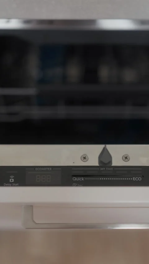 Close up of modern dishwasher control panel and door handle in clean kitchen Vidéo 344824502
