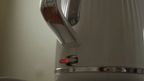 Close-up of modern electric kettle automatically switching off after boiling Stock Footage 306272994