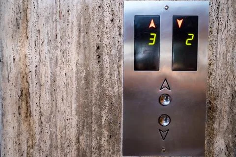 Close up modern elevator call buttons and screen Stock Photos
