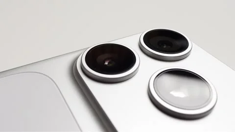 Close-up of Modern Flagship Smartphone Triple Camera Module Stock Footage 329568107