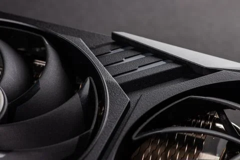 A close up of a modern GPU Graphic card on dark background. Stock Photos