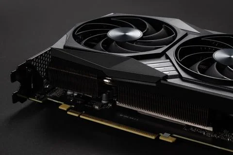 A close up of a modern GPU Graphic card on dark background. Stock Photos