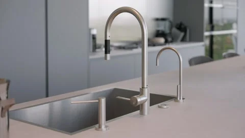 Close up of modern kitchen sink and faucet installed between detergent dispenser Stock Footage 282283673