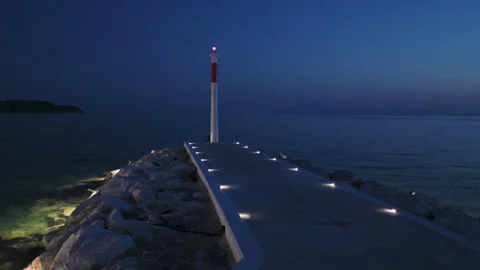 Close-up of Modern Lighthouse and Illuminated Pier at Twilight Vídeo Stock 341681775