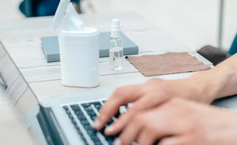 Close up. modern man using laptop during quarantine. Stock Photos