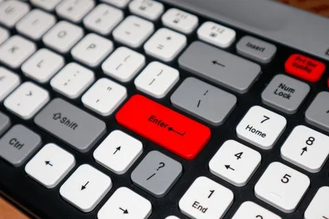 Close-up of a modern mechanical keyboard featuring a prominent red Enter ke.. Stock Photos